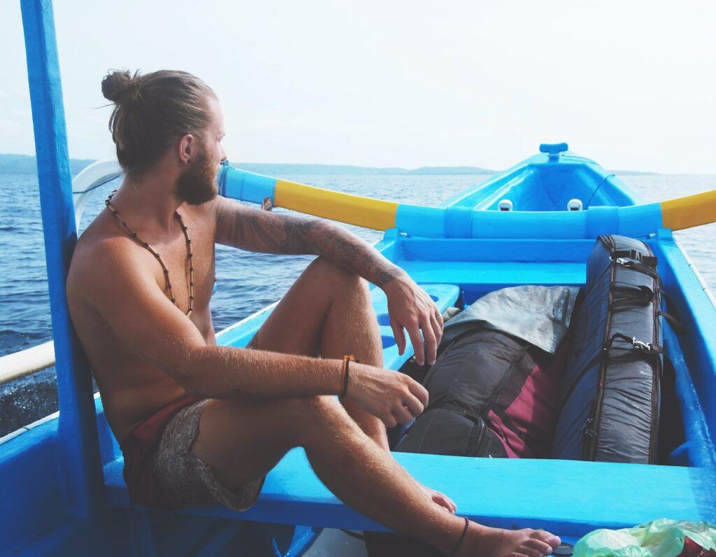 man sitting on boat